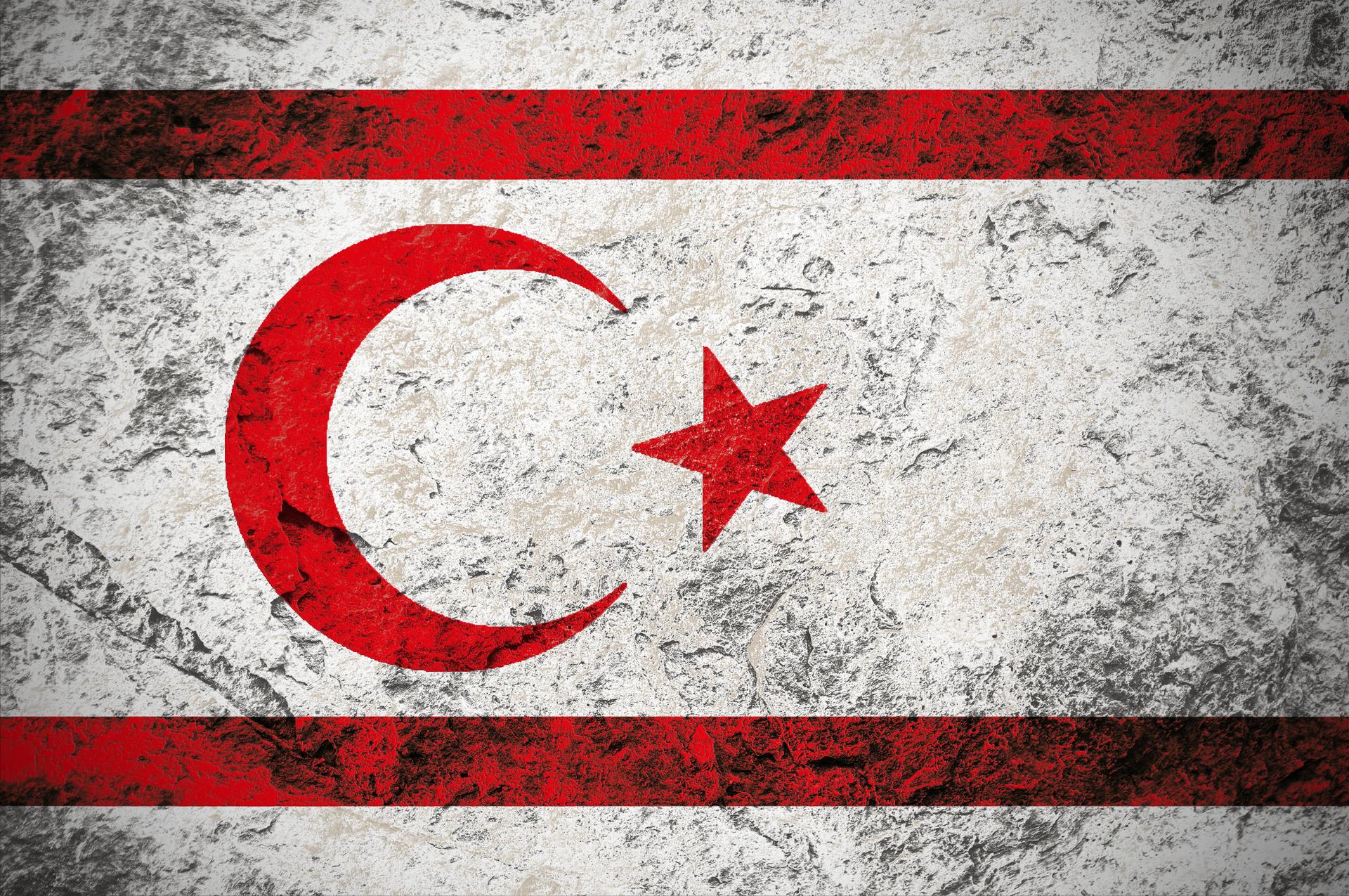 Turkish Republic of Northern Cyprus flag on stone background