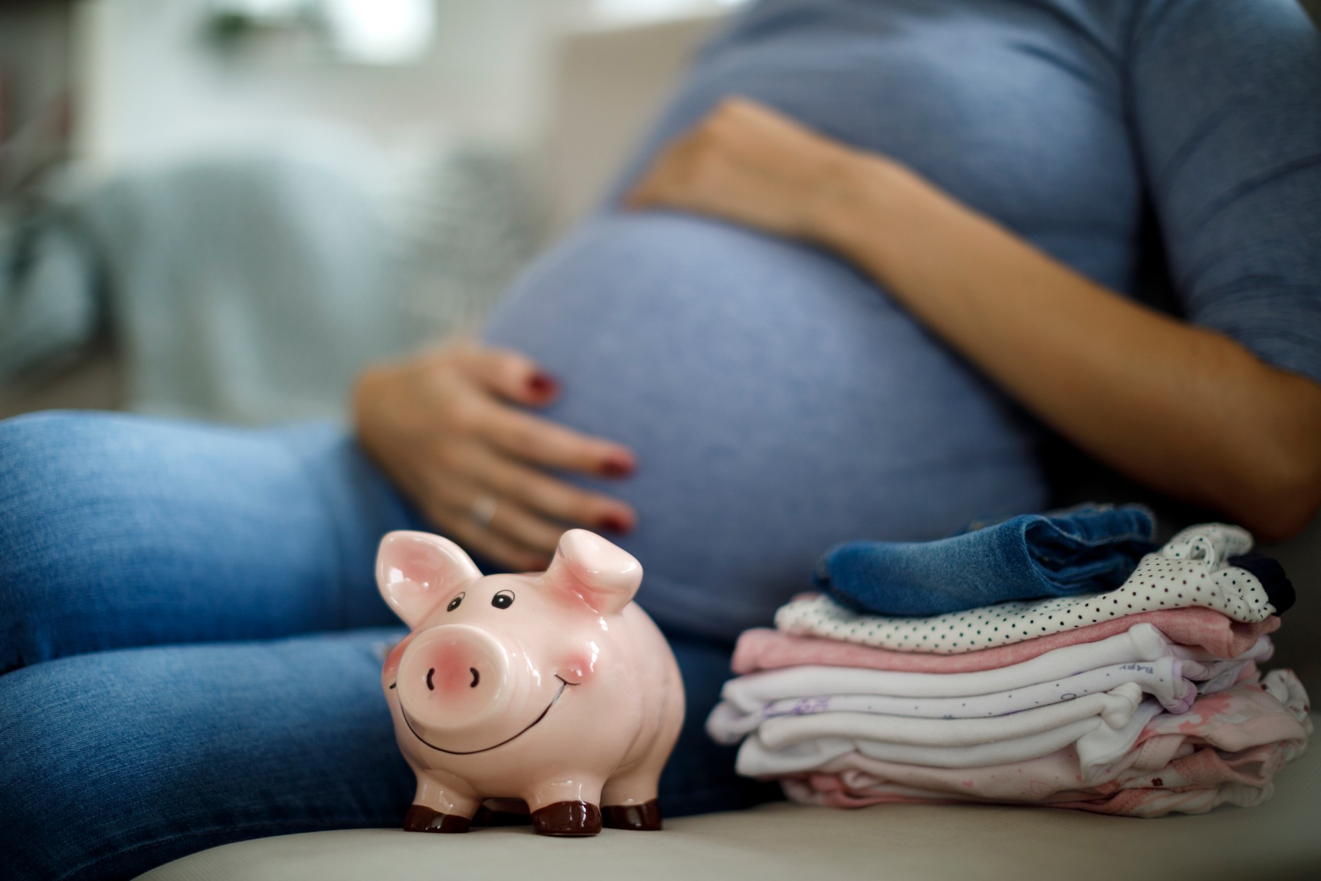 Pregnant woman saving up for baby