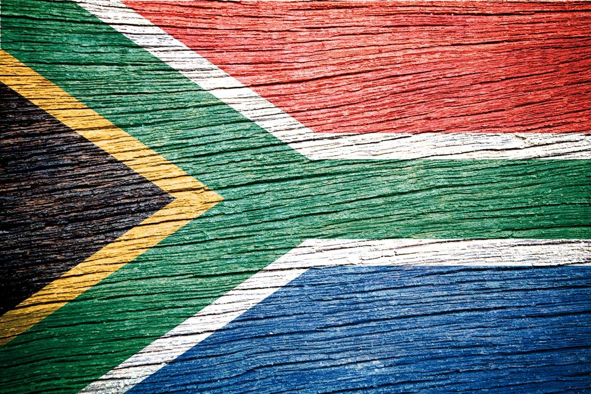  South Africa flag on wood texture background 